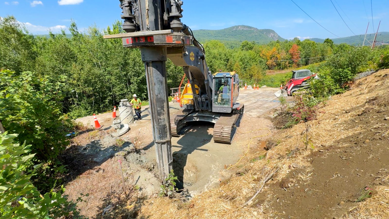 A construction drill in the ground.